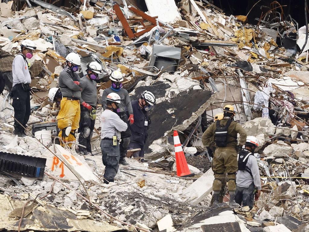 Search and rescue teams look for possible survivors. Picture: Michael Reaves/Getty Images