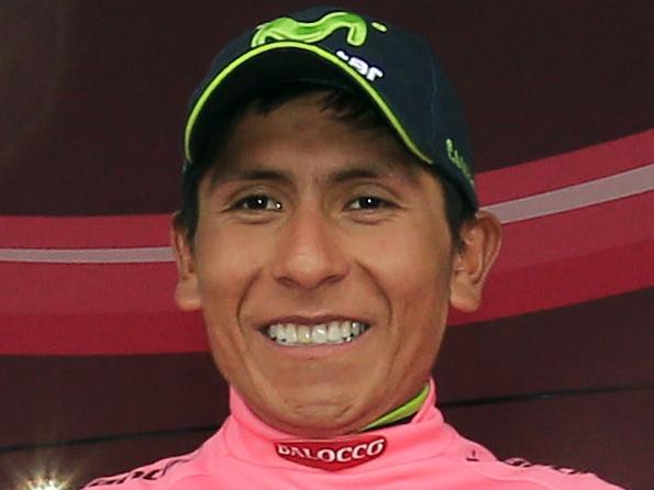 Colombian cyclist Nairo Quintana celebrates with the pink jersey of the overall leader on the podium, after the 26,8 km 19th stage of the 97th Giro d'Italia, Tour of Italy, cycling race from Bassano del Grappa to Cima Grappa (Crespano del Grappa), on May 30, 2014, in Cima Grappa. AFP PHOTO / LUK BENIES