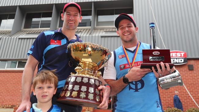 Sturt coach Marty Mattner, with son Oscar, and Sturt captain Zane Kirkwood show off the Thomas Seymour Hill trophy after this year’s West End Brewery’s Chimney unveiling. Picture: Tait Schmaal.