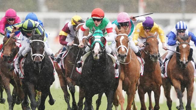 Damian Lane and Mer De Glace leads the Caulfield Cup field. Picture: AAP