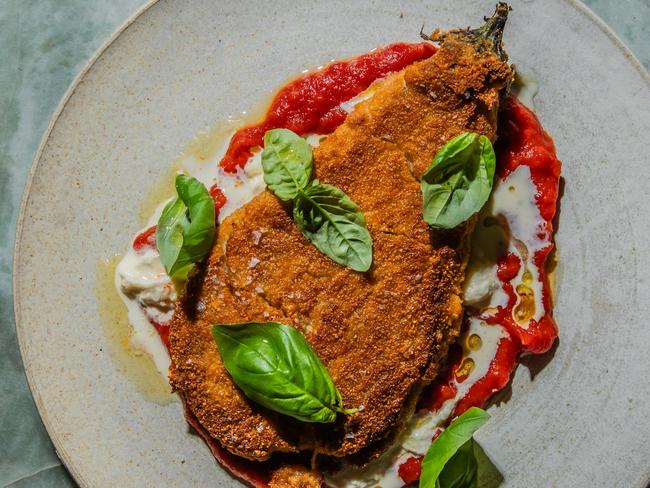 EMBARGO FOR TWAM 22 JUNE 2024. FEE MAY APPLY.Eggplant parmy and mixed lettuce salad by chef Lennox Hastie. Photo: Nikki To