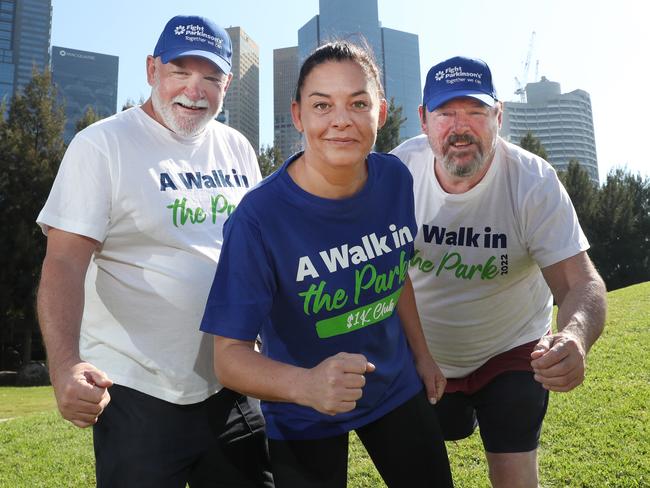 Kate Jesaulenko and Alex Jesaulenko’s former Carlton teammates Jimmy Buckley and Wayne Harmes before the Walk in the Park in March last year. Picture: David Crosling