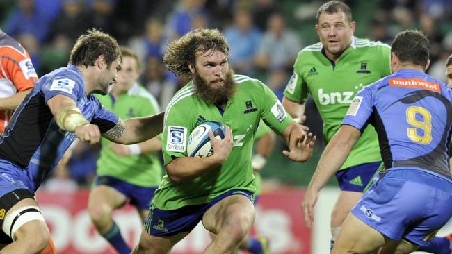 Highlanders hooker Liam Coltman runs through the Force defence.