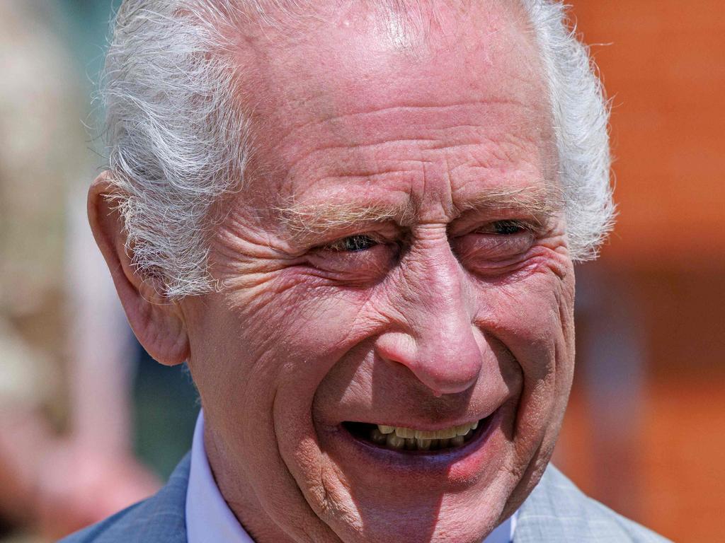 King Charles laughs as he meets with members of 3 Royal School of Military Engineering at Gibraltar Barracks in Minley, southern England. Picture: AFP