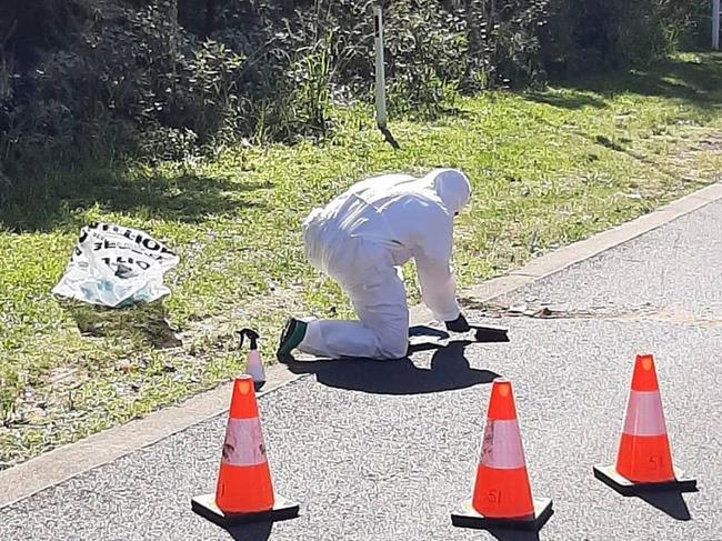 A firefighter from NSW Fire &amp; Rescue's Forestville Brigade cleans up dangerous asbestos building material dumped in a residential area on the northern beaches. Picture: NSW Fire &amp; Rescue