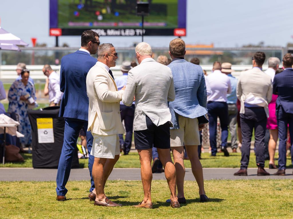 Outside the Birdcage, some men in general admission could be seen rocking shorts. Picture: Jason Edwards