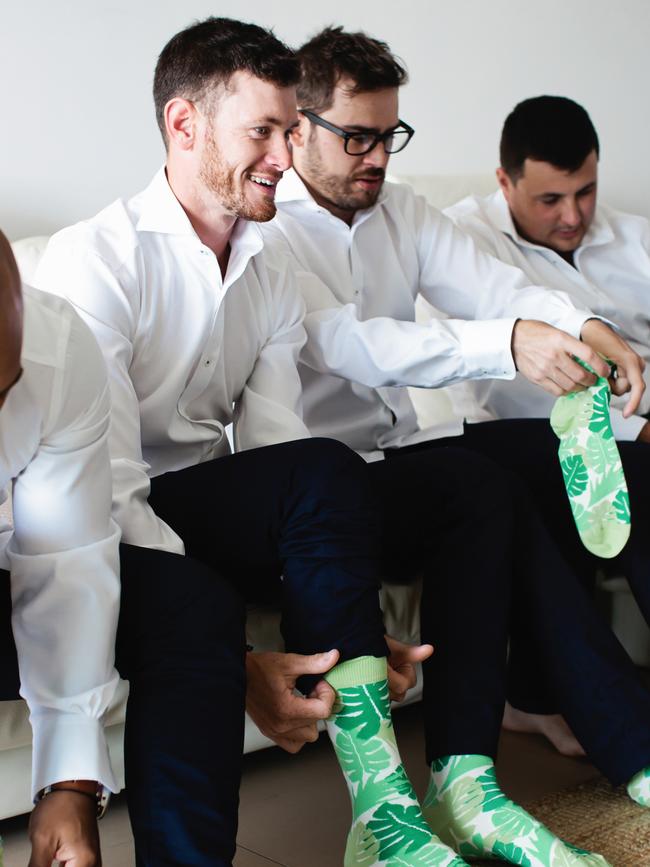 Good price for matching socks: Brendan Scheiwe and groomsmen get ready, photography: Quince and Mulberry Studios