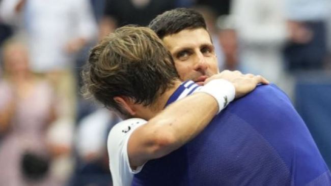 Djokovic congratulates Medvedev at the net