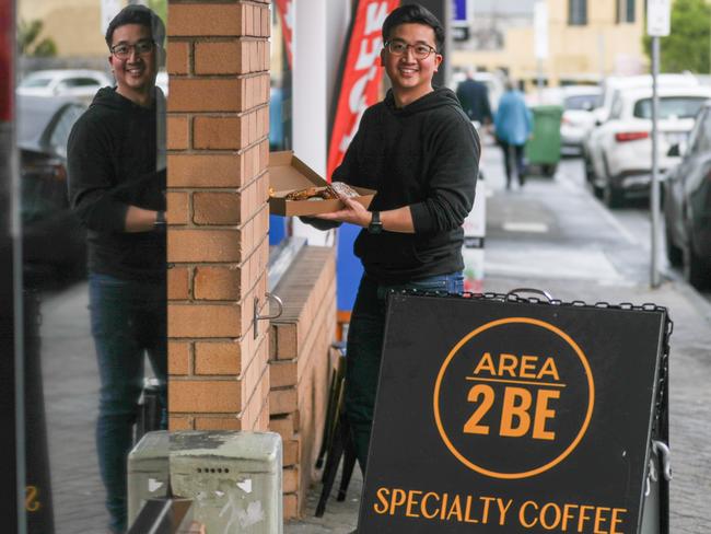 Bryan Teo carries a tray of Six Russell Bakes pastries into the busy pop-up at Area 2BE in Sandy Bay. Picture: Linda Higginson