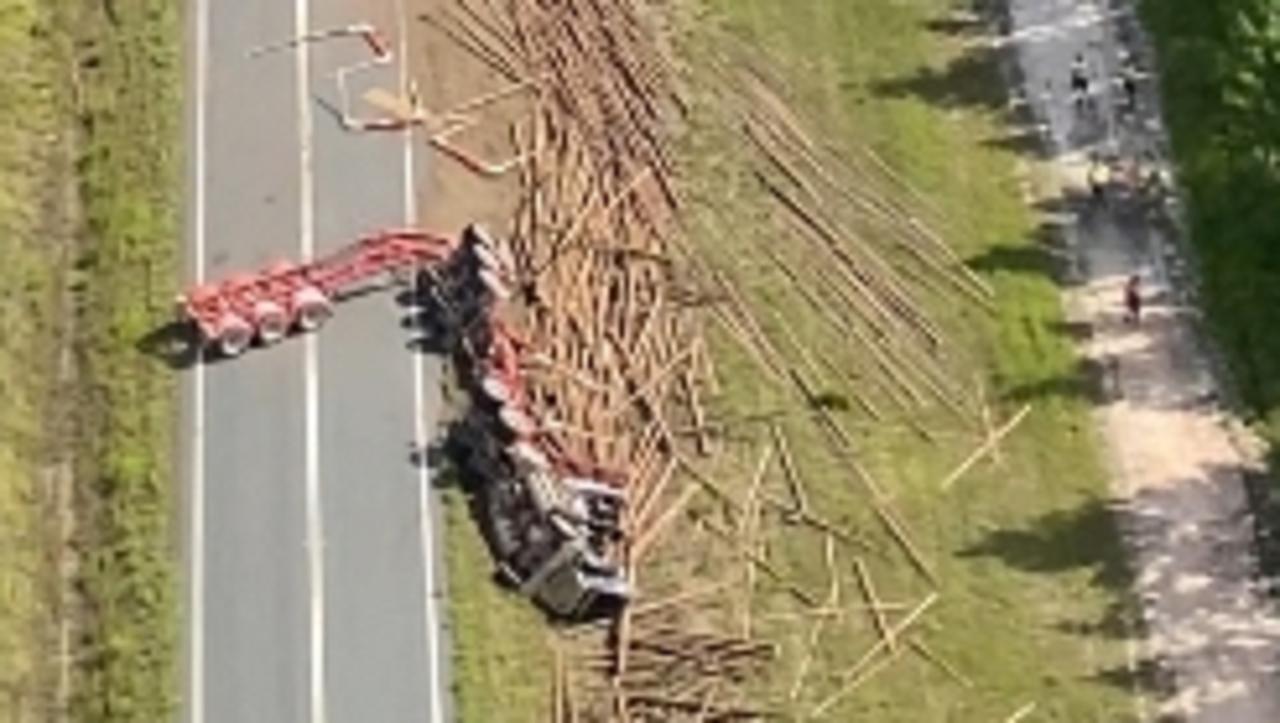 Shock photos: Man flown to hospital after logging truck rolls