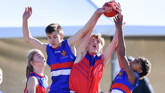 Playford and Torrens River battle for the ball at the School Sport SA Sapsasa Metro Football Carnival at West Beach. Picture: Mark Brake