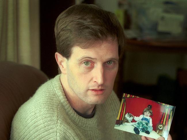 John Sharpe holds a picture of his daughter Gracie as he asks for help to find her and her mother. File picture