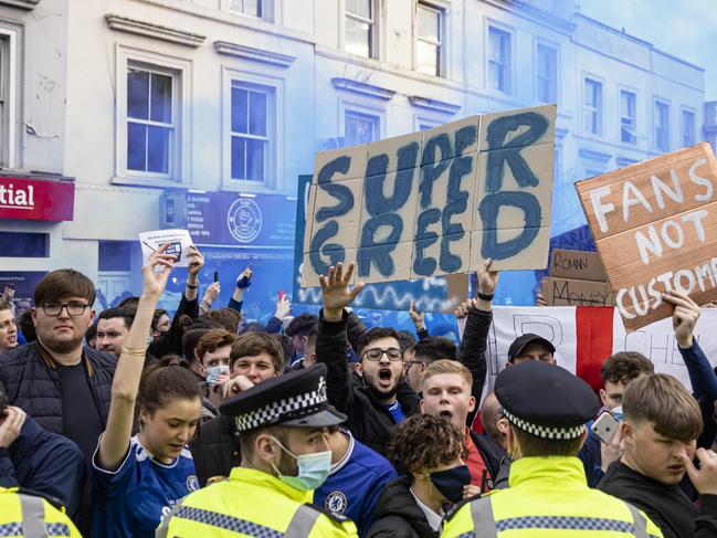 LONDON, ENGLAND - APRIL 20: Fans of Chelsea Football Club protest against the European Super League outside Stamford Bridge on April 20, 2021 in London, England. Six English premier league teams have announced they are part of plans for a breakaway European Super League. Arsenal, Manchester United, Manchester City, Liverpool, Chelsea and Tottenham Hotspur will join 12 other European teams in a closed league similar to that of the NFL American Football League. In a statement released last night, the new competition 