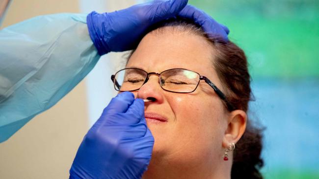 A nurse takes a nasal sample of a nursing aide for a rapid Covid-19 test before she can start her shift at a nursing home for elderly in Lerum, Sweden on December 18, 2020. Picture: Adam Ihse / TT News Agency / AFP