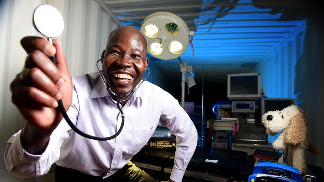 Adelaide Uni student John Nelson Opio inside the shipping container, with some of the medical equipment donated from the old Royal Adelaide Hospital. Picture: Bianca De Marchi