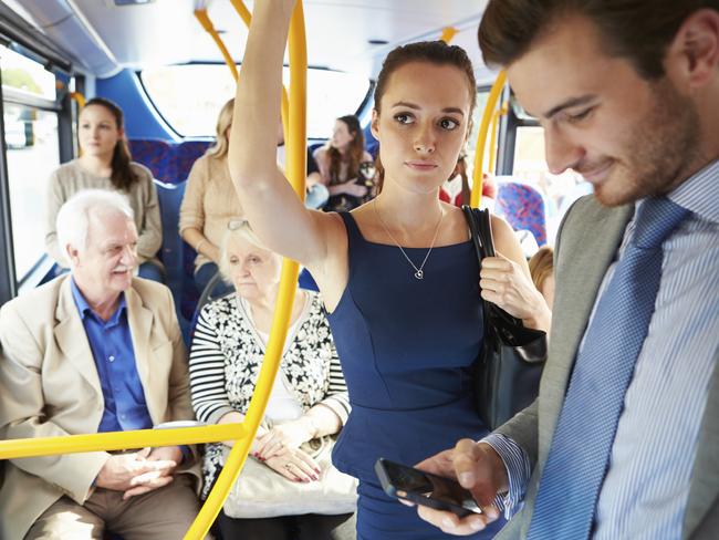 RendezView. Passengers Standing On Busy Commuter Bus.