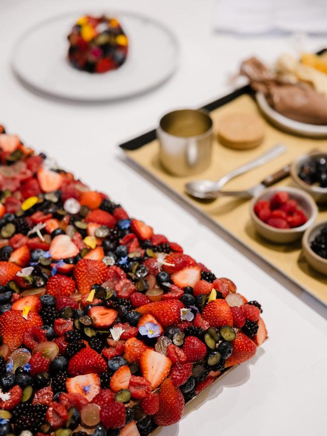 The plant-based cake contains light hazelnut sponge, fresh mango, passionfruit jam and mousse, rich chocolate mousse, adorned with fresh summer berries.