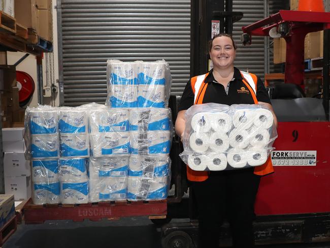 Louise Taylor at Madken Washroom Accessories shows off their plentiful supply of toilet paper. Picture: Brett Costello