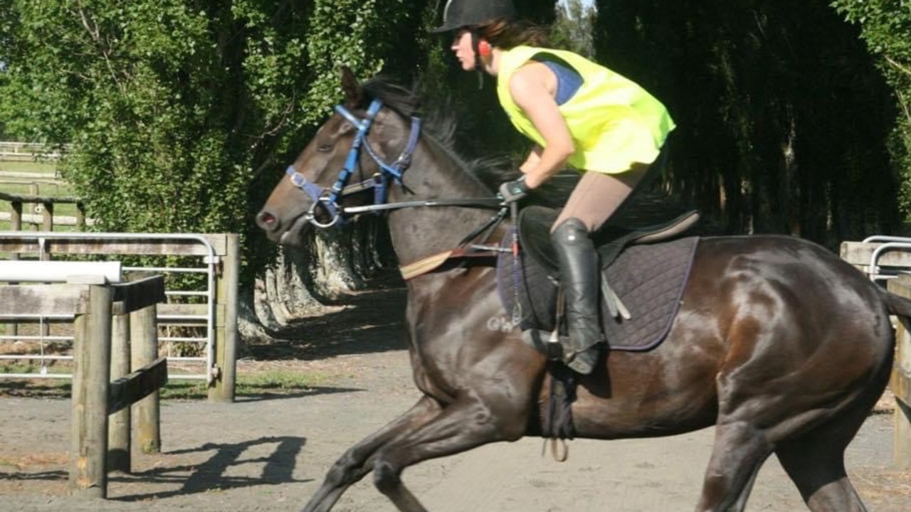 Verry Elleegant showing her style back in the day withtrackwork rider Ceilidh Johnston.