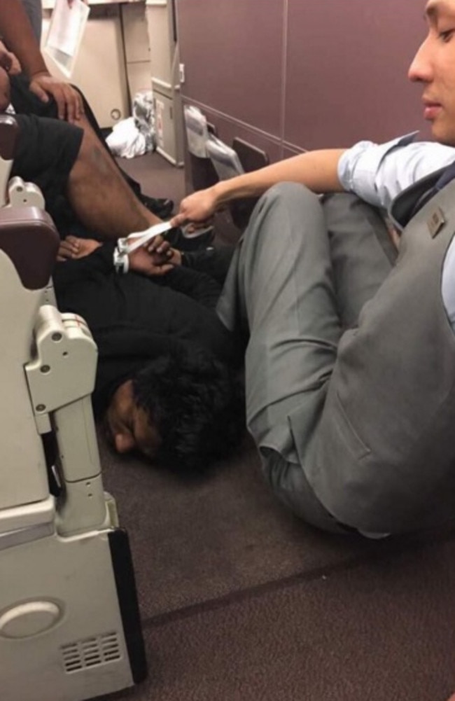 The man is detained on the flight.
