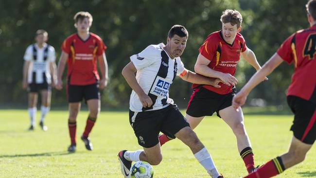 Willowburn captain Beau Partridge (left) takes on the Gatton defence. PHOTO: Kevin Farmer