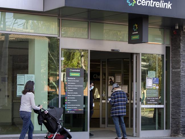 A customer talks to a staff member at Centrelink in Melbourne during stage 4 lockdowns. Picture: NCA NewsWire/David Geraghty