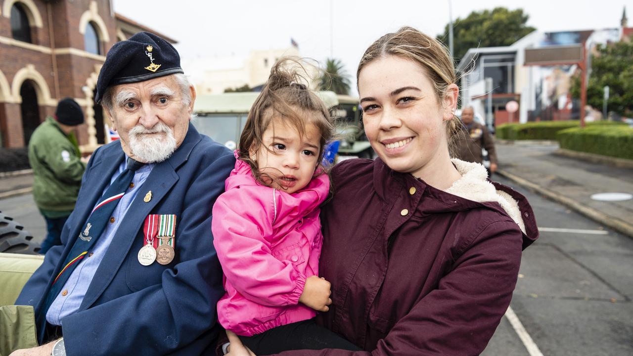 Veteran Ian McLennan with his granddaughter Mia McLennan and Emily McLennan before the Anzac Day morning march and service, Monday, April 25, 2022. Picture: Kevin Farmer