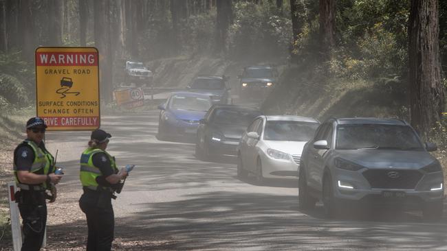 A string of cars crawls out of the site. Picture: Jason Edwards