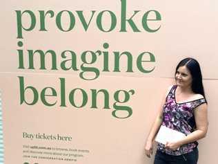 Scene from Brisbane Writer's Festival with a sign encouraging people to read, provoke, imagine, belong