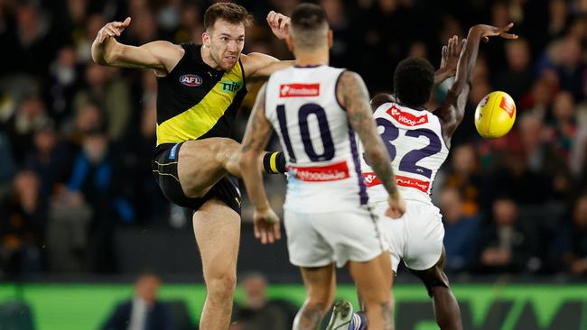 Michael Frederick runs down Balta’s kick on goal after the umpire called play on. Picture: Michael Willson/AFL Photos via Getty Images