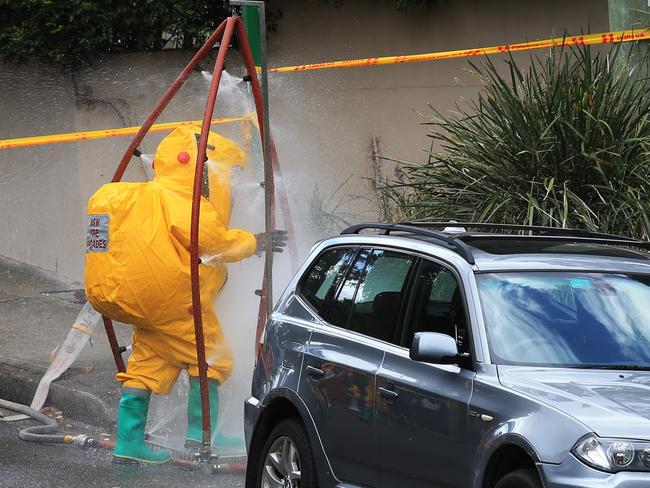 A hazmat worker decontiminates after the incident. Picture: Toby Zerna