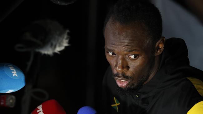 Jamaica's Usain Bolt speaks to the press after the final of the men's 100m.