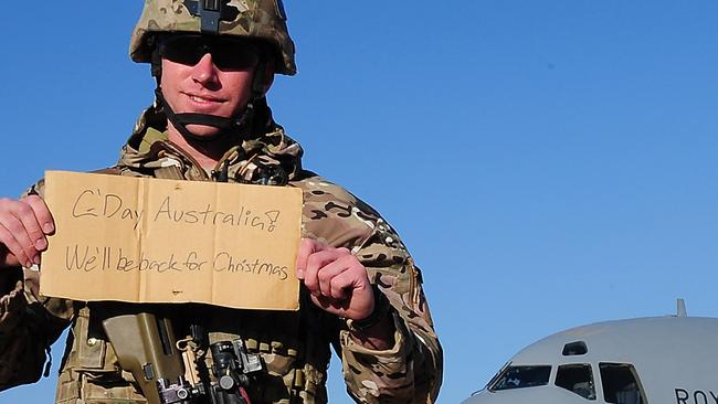 AUSSIES DEPART AFGHANISTAN .. Leading Aircraftman Noel Klaehn lets Australians know he and his mates will be home for Christmas on his last day in Tarin Kot, Uruzgan on 15 December 2013. *** Local Caption *** The Australian Defence Force (ADF) has officially departed Uruzgan Province in Southern Afghanistan.The final two aircraft, both C-17 aircraft, departed Multi National Base - Tarin Kot (MNB-TK) on December 15, 2013 and arrived at Al Minhad Air Base in the United Arab Emirates that afternoon. The passengers and flight crew were met on the tarmac by Commander Joint Task Force 633 Major General Craig Orme, who congratulated the troops on the successful completion of their mission. The exodus came just four days after the Australian Commander of Combined Team Uruzgan, Colonel Wade Stothart officially signed over control of MNB-TK to the Government of the Islamist Republic of Afghanistan. The ADF’s departure from Uruzgan does not signal the end of Australia’s commitment to Afghanistan, with approximately 400 military members to remain in the country post 2013 in a variety of train, advise and assist roles.
