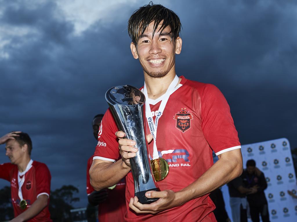 Wolves’ Takeru Okada with the trophy after victory in last year’s NRL grand final.