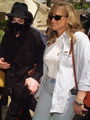 Michael Jackson, left, and his wife Debbie Rowe in 1996. Picture: AP