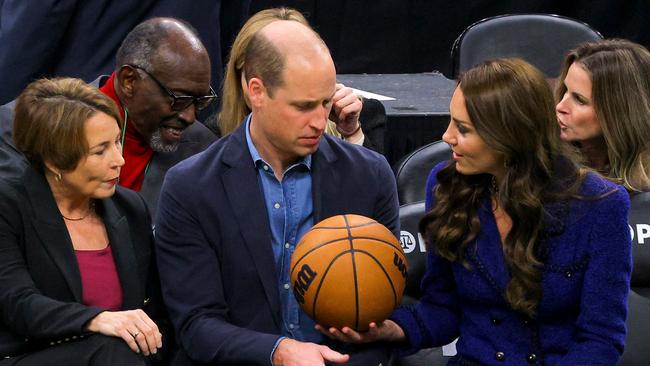 Massachusetts Governor-elect Maura Healey watches as Britain's Prince William is handed a basketball by Kate. Picture: AFP