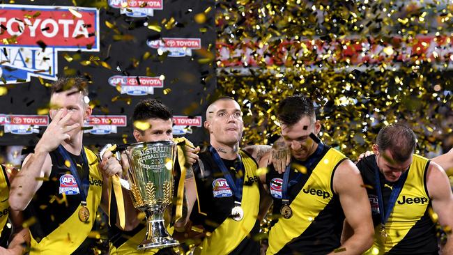 Dustin Martin of the Tigers and team mates celebrate victory after the 2020 AFL Grand Final at The Gabba. Picture: Bradley Kanaris/AFL Photos/via Getty Images