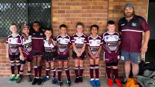 U8s and U8s Eastern Suburbs teams with coach Lindsay Locke.