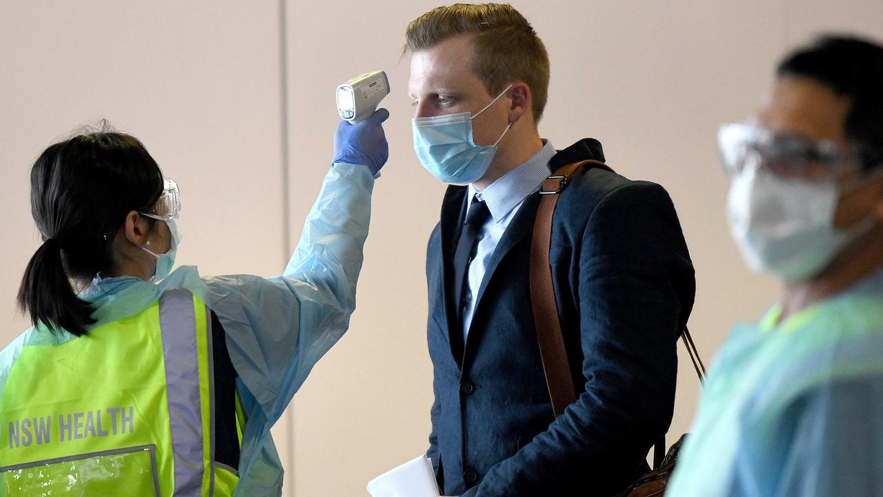 Passengers off a Melbourne fight are temperature tested at Sydney airport, which detects only about 20 per cent of coronavirus cases. Picture: Bianca De Marchi/NCA NewsWire