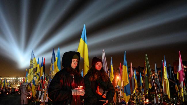 A symbolic illumination called Rays of Memory is seen over the graves of Ukrainian soldiers who died in the war with Russia. Picture: Yuriy Dyachyshyn/AFP