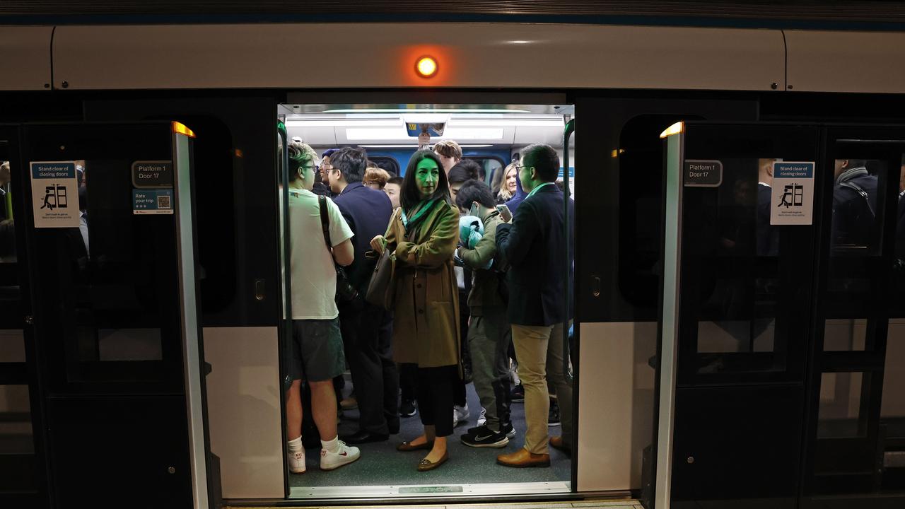 Pictured at Sydenham Station are among the first passengers on the brand new Sydney Metro on its maiden run to Tallawong at 4.54am. Picture: Richard Dobson