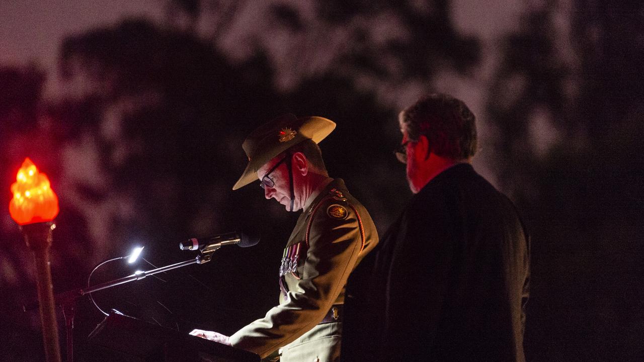 Commanding Officer 25th/49th Battalion Royal Queensland Regiment LTCOL David Fraser delivers the Call to Remembrance during the Anzac Day dawn service, Monday, April 25, 2022. Picture: Kevin Farmer