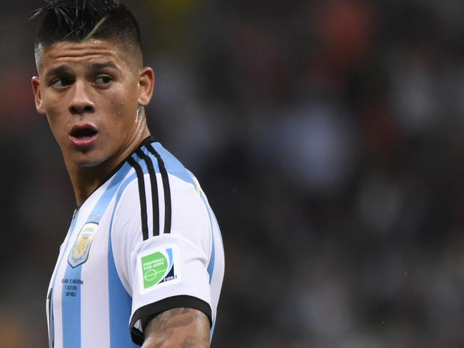 (Files) In this file picture taken on July 9, 2014, Argentina's defender Marcos Rojo reacts during the second half of extra time during the semi-final football match between Netherlands and Argentina at the FIFA World Cup in Sao Paulo. Manchester United completed the 20 million euro signing of Argentina World Cup defender Marcos Rojo from Sporting Lisbon on Wednesday, August 20, 2014, with Old Trafford boss Louis van Gaal hailing the 24-year-old as a "gifted" player. Rojo signed a five-year contract after impressing during the World Cup where he helped Argentina to reach the final. AFP PHOTO / FABRICE COFFRINI