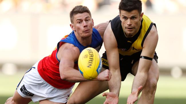 Dayne Zorko spoils Richmond captain Trent Cotchin in Round 23.