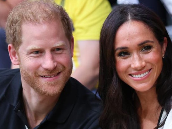 DUESSELDORF, GERMANY - SEPTEMBER 13: Prince Harry, Duke of Sussex and Meghan, Duchess of Sussex pose for a photograph as they attend the Wheelchair Basketball preliminary match between Ukraine and Australia during day four of the Invictus Games Düsseldorf 2023 on September 13, 2023 in Duesseldorf, Germany. (Photo by Chris Jackson/Getty Images for the Invictus Games Foundation)