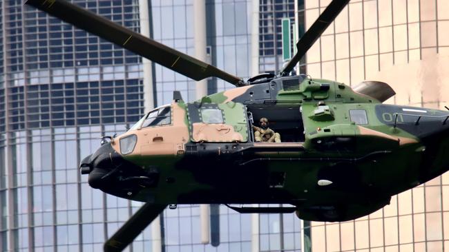 MRH-90 Taipan Battlefield Mobility helicopters and an EC655 Eurocopter Tiger Armed Reconnaissance helicopter rehearsal fly over for Brisbane Riverfire.