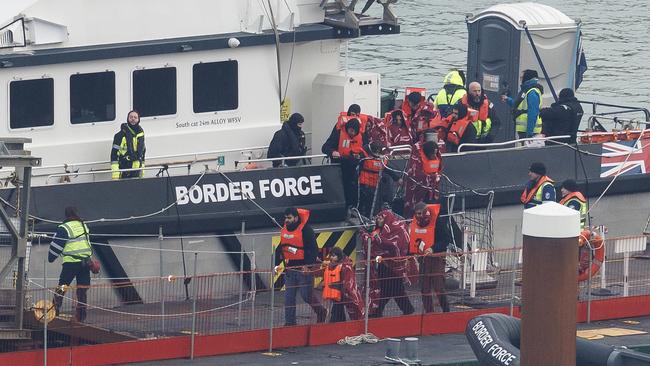 Migrants are brought ashore after being picked up in the English Channel by a Border Force vessel. Picture: Getty Images