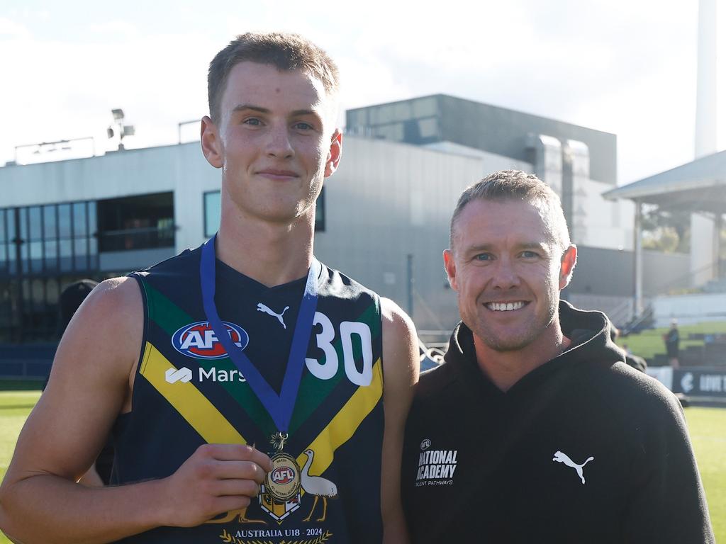 Luke Trainor with AFL Academy coach Tarkyn Lockyer. Picture: Michael Willson/AFL Photos via Getty Images