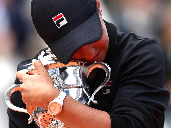 Ashleigh cuddles the French Open trophy after winning the final in Paris. Picture: Getty