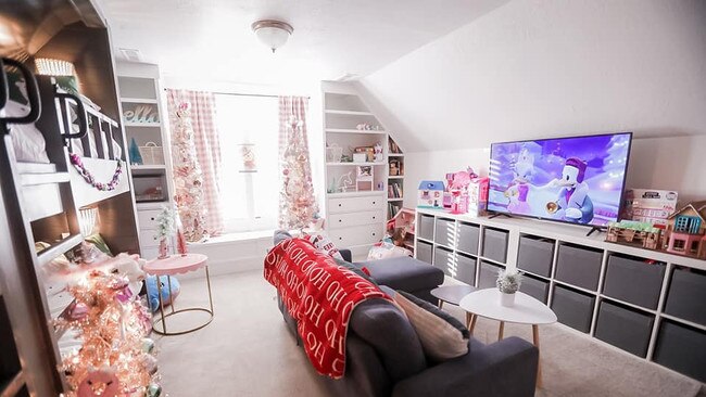 The woman added a sofa, a TV and some storage in the room for toys. Credit: Facebook